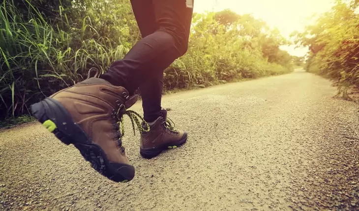 woman hiking on forest trail