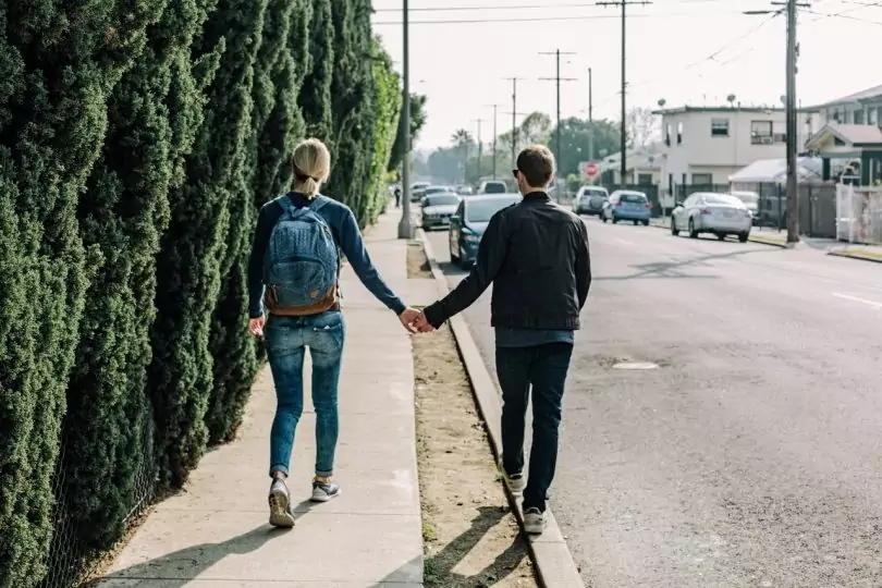 couple walking together on a road