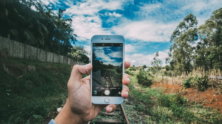 Person Holding Silver Iphone 6 Taking Photo