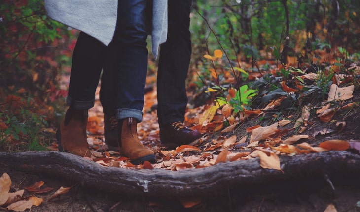 Two adults in the forest