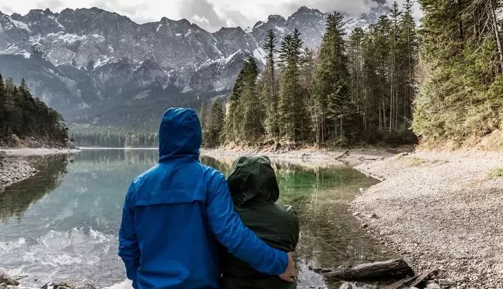 couple watching a beautiful mountain landscape