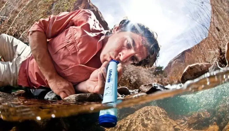 A man using a water filter