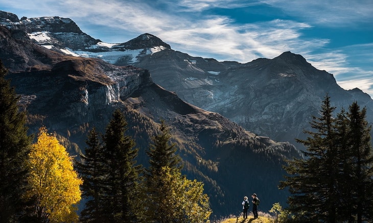 Two hikers and a mountain landscape