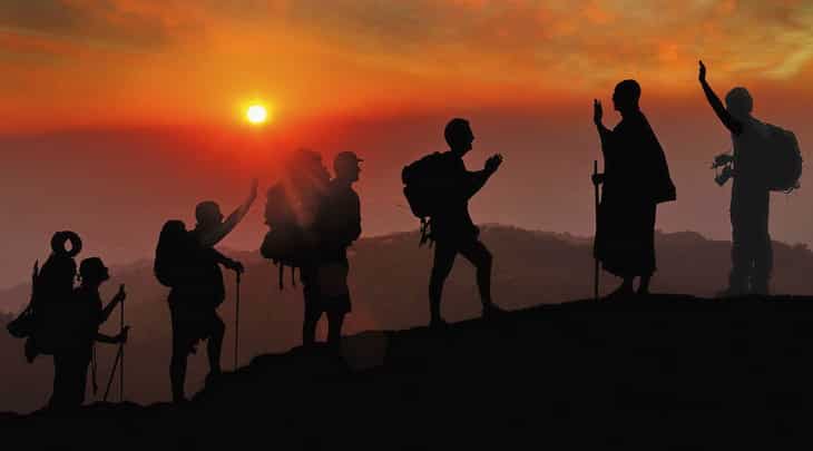 group of hikers at sunset