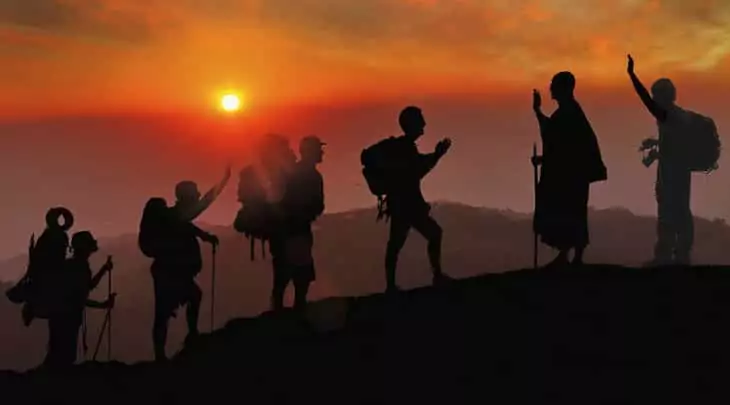 group of hikers at sunset