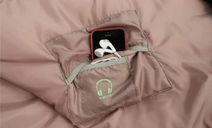 A phone in Kelty Tuck 30 Degree Sleeping Bag pocket