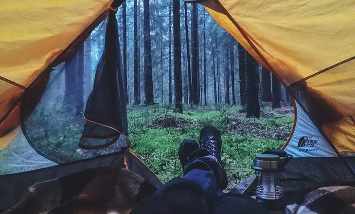 A man camping in the Igor-Cibulsky-Pine-Forest