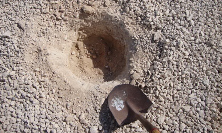 Burrowing a pit for solar still