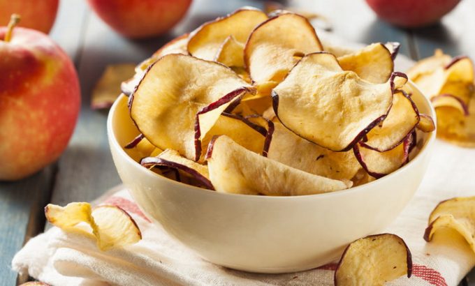 baked dehydrated apples chips in a bowl
