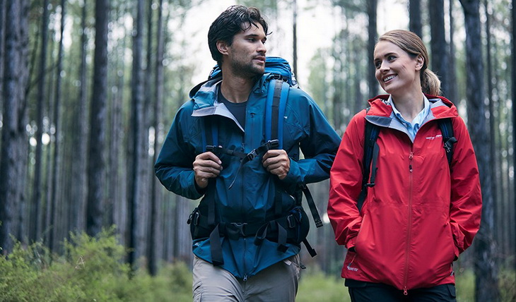 A couple wearing Gore- Tex jackets on a rainy day