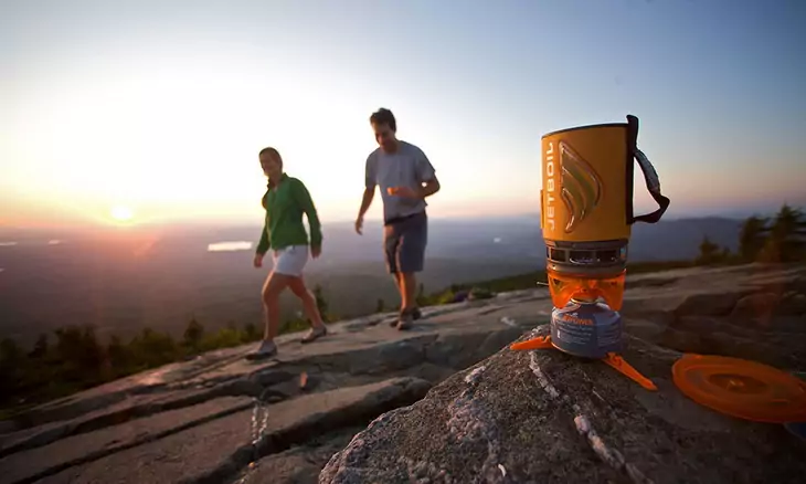 Jetboil Flash Personal Cooking System and two adults passing by