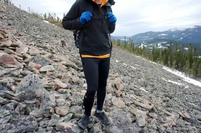 A oerson hiking in tights