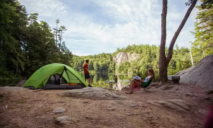 Two people camping in the forest