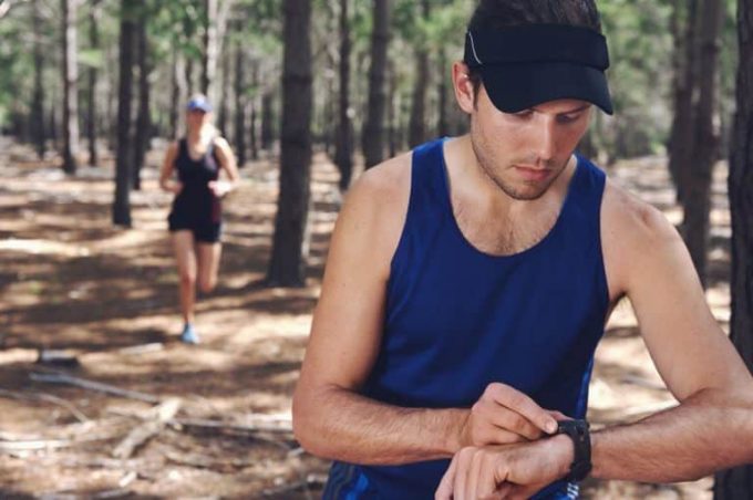 Man uses heart rate monitor