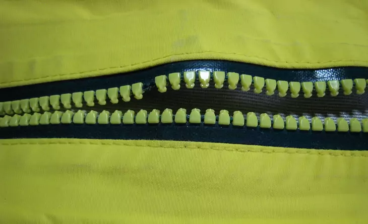 Missing tooth on a waterproof vislon zipper.