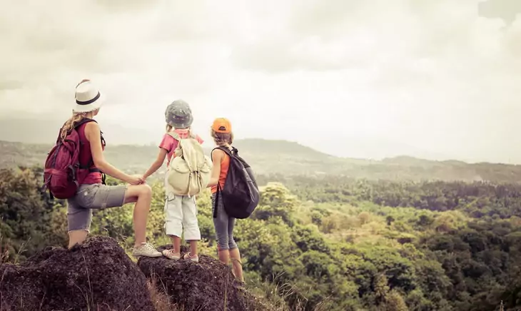 Mother hiking with her childrens