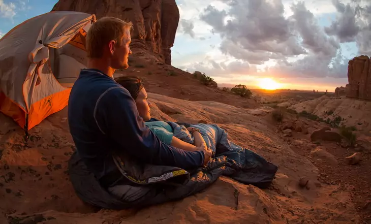 A couple camping in a romantic destination