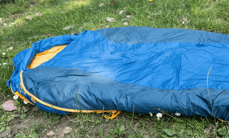 Kelty Cosmic 20 Degree Sleeping Bag on the grass outside