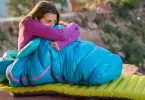 Woman relaxing outside in a sleeping bag
