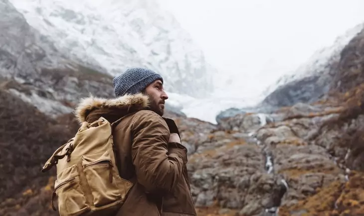 Man-with-backpack-trekking the mountains