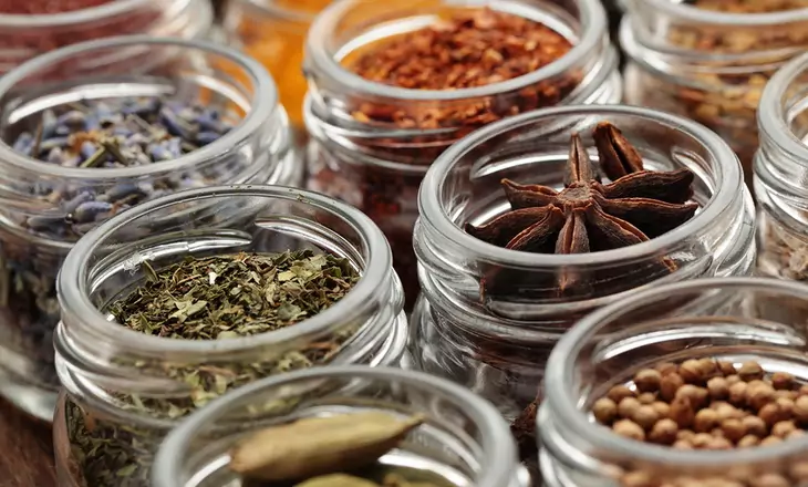 Rows of jars with various spices