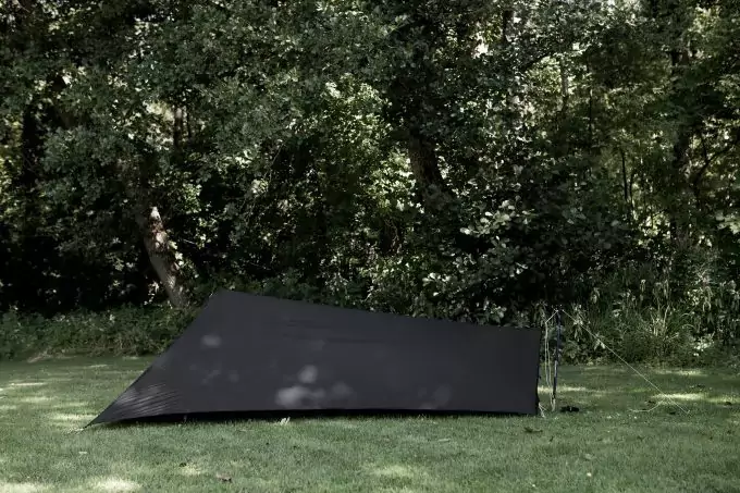 black-tarp-tent-on-grass-680x453