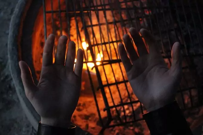 Testing fire with hands