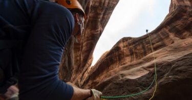 Two adults canyoneering
