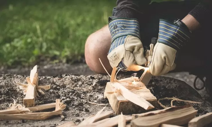 Man starting a campfire