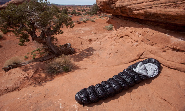 Klymit KSB 20 Sleeping Bag laying on the ground outside in the wild