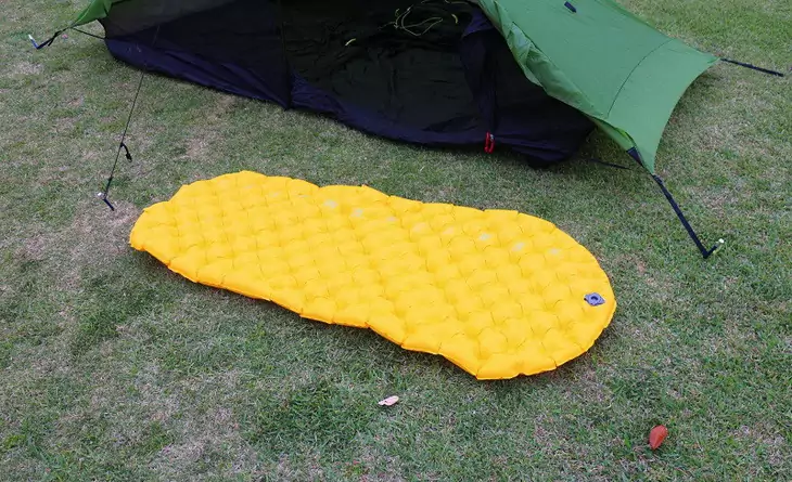 Sea to Summit Ultralight Mat on the grass next to a tent