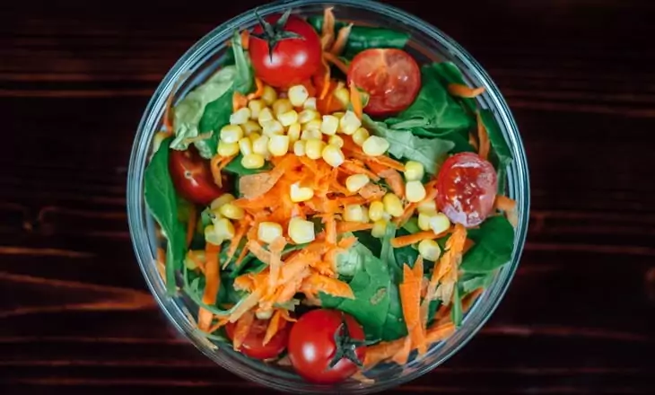 Tomato Carrots Corn Salad on Clear Glass Round Bowl