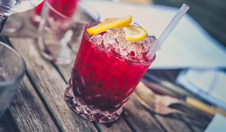 Red Drink on Clear Glass With Lemon on Top