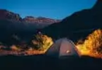 A tent outside in the nature during night time