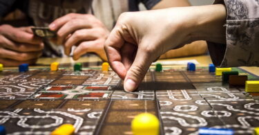 Friends playing a board game