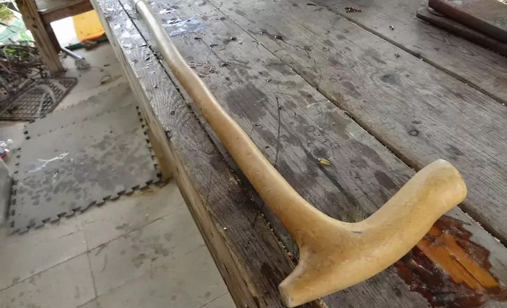 Walking stick on a wooden working table