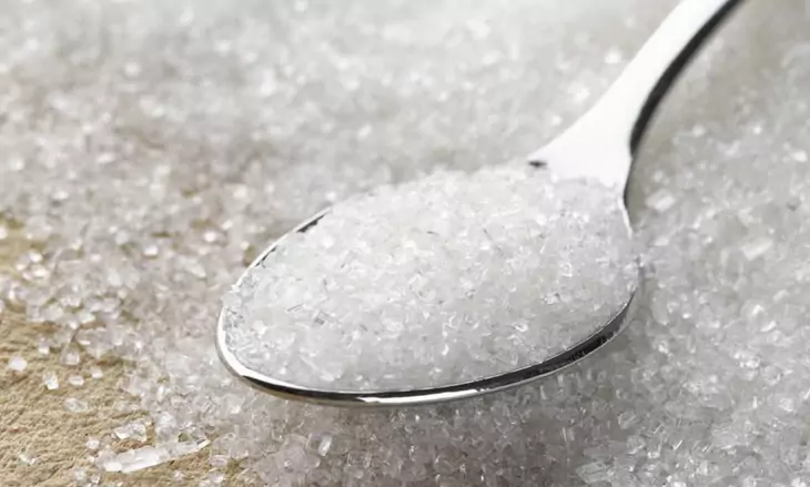 image of sugar in a spoon