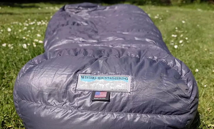 Western Mountaineering Cypress sleeping bag on the grass