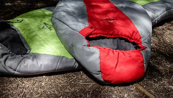 TETON Sports LEEF 0 sleeping bags on the ground in a forest