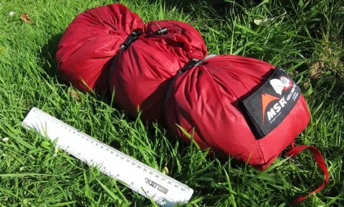Image showing a MSR Hubba Hubba NX 2-Person Tent packed sitting on the grass
