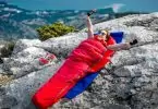 A woman sitting in the Nemo-Fusion-Hybrid sleeping bag