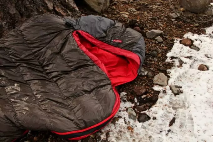 Nemo Nocturne Sleeping Bag on the ground outside near a water