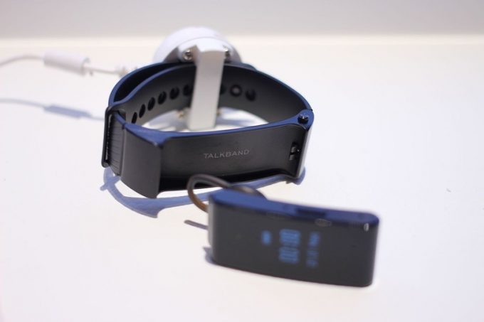 Huawei TalkBand GPS fitness tracker on a white table