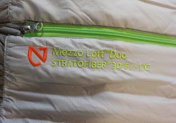 Image showing a ilver Nemo Mezzo Loft Duo-stratofiber with green zipper
