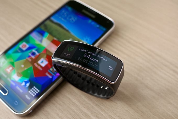 Samsung Galaxy S5 with Gear Fit on a table