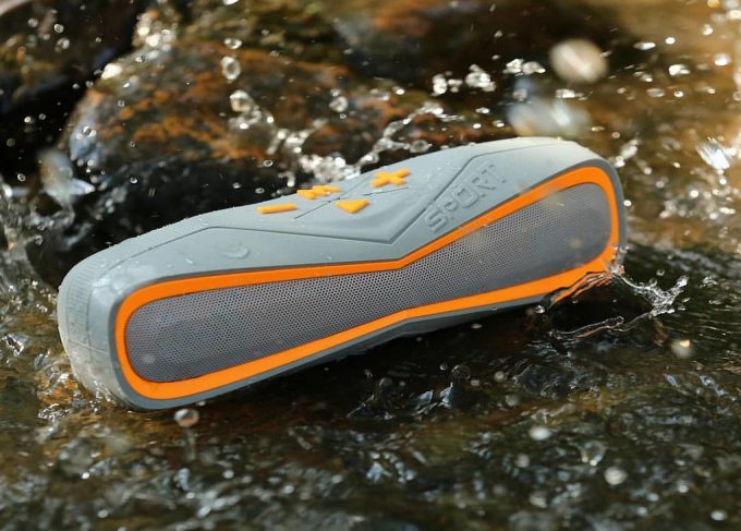 Sport silver and orange Bluetooth speaker is totally waterproof