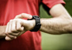 Image showing a runner looking at his fitness watch