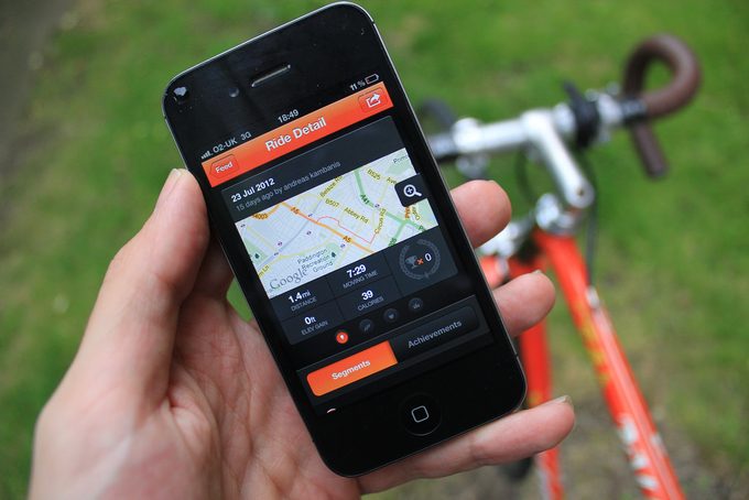 Image showing a person using Strava app before riding his bicycle 