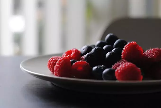 Raspberries and blueberries in a bowl