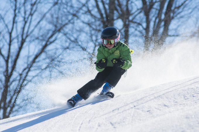 a kid dashing through snow